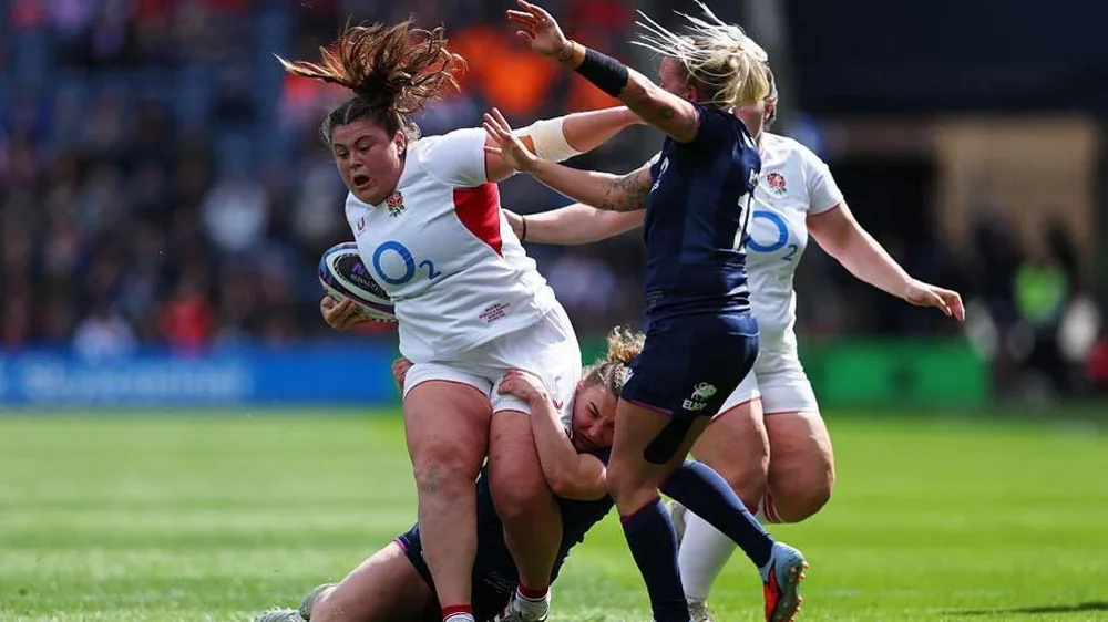Maud Muir carries the ball